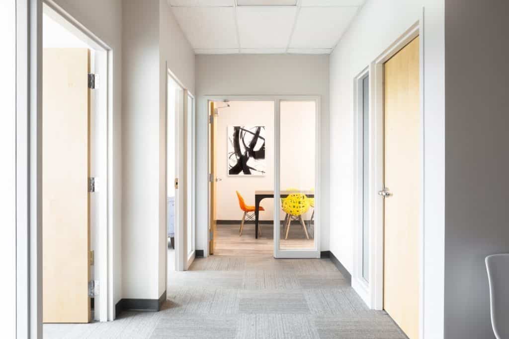 Photo of the hallway leading to the various offices of Arcara Personalized Psychiatry's office space.
