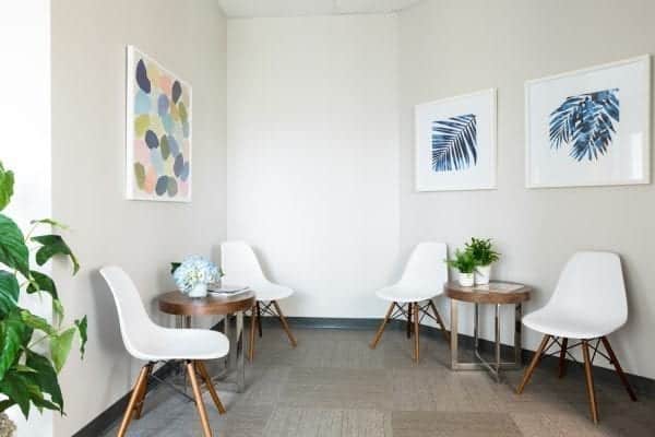 Kims-Office_Northborough__6-600×400 Kimberly Arcara's office space in North Borough featuring chairs, plants, and pictures hanging in the background