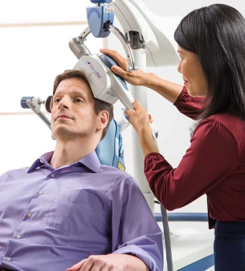 Patient undergoing TMS therapy