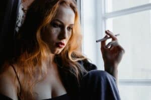 tms-for-bipolar-depression-woman-smoking-a-cigarette (1)